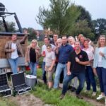 Na de ballonvlucht nemen we steeds een groepsfoto tijdens de gezellige apres van de ballonvaart.